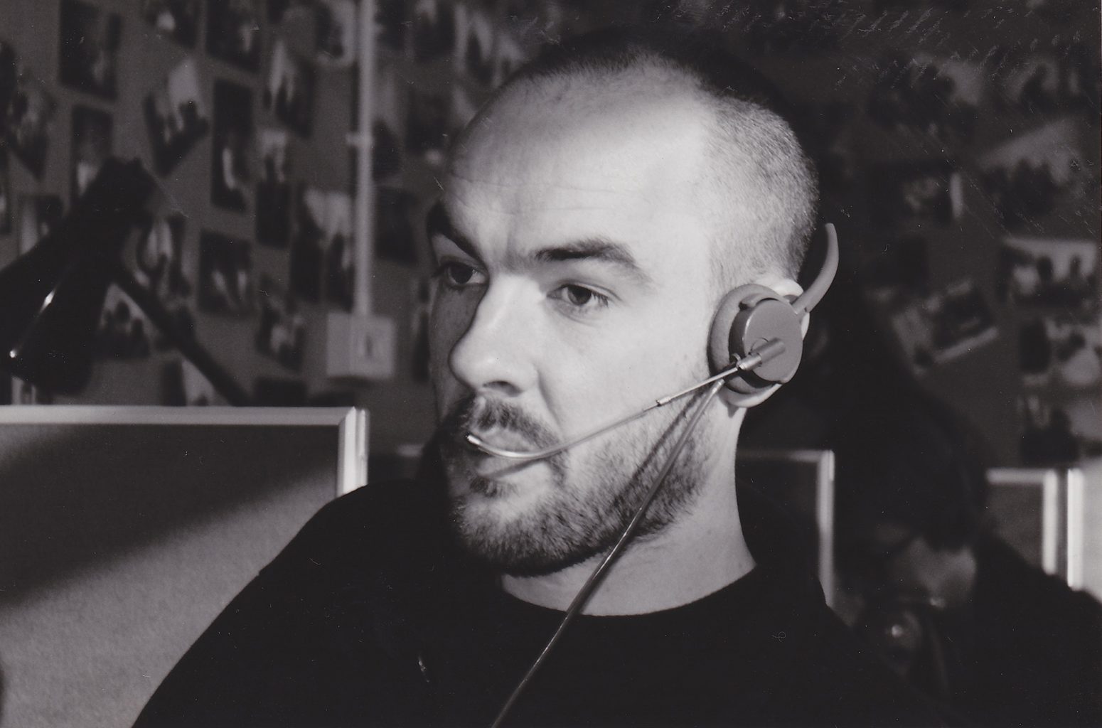 A photo of Mark when he was younger working a phone line